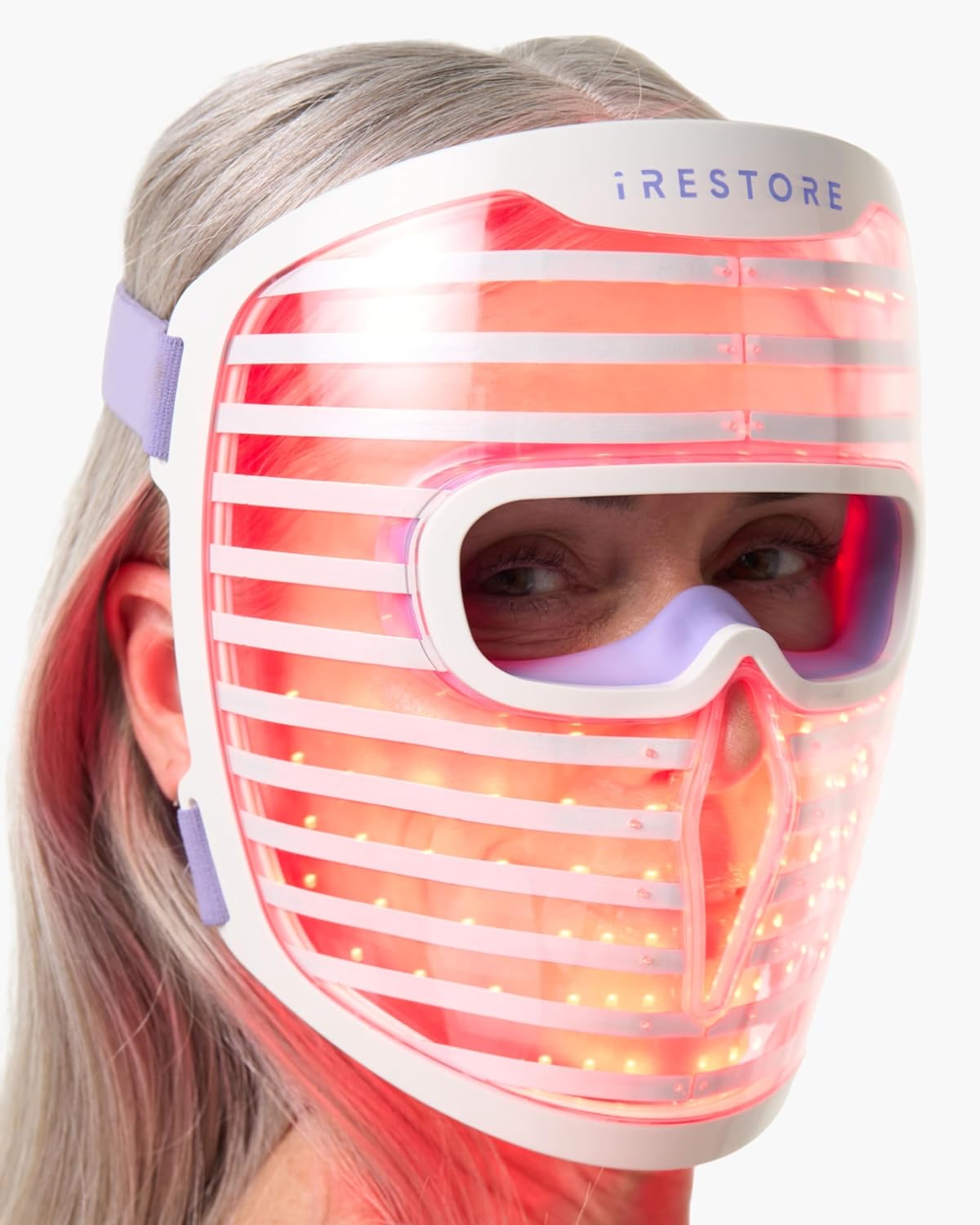 iRestore Illumina LED face mask worn showing 360 medical-grade LEDs red light therapy